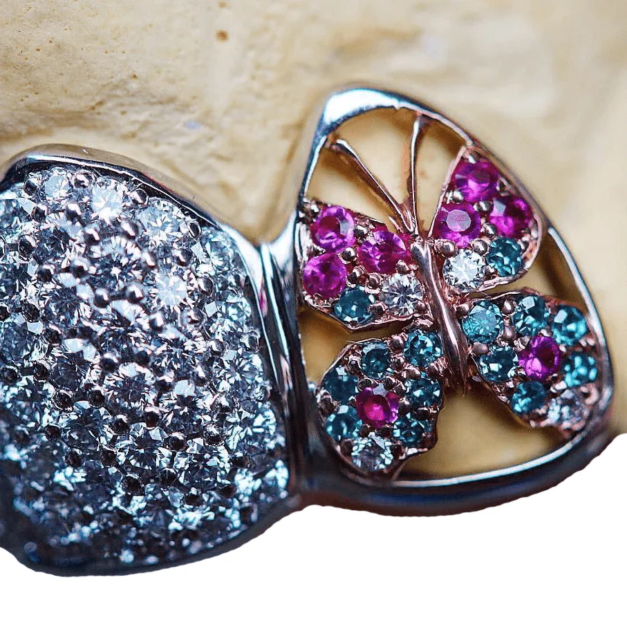 Diamond and colored stone butterfly bridge detail.